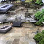 Before and after photo of stone paver patio cleaned by Bright Solutions ProWash, showing removal of dirt, moss, and weather stains
