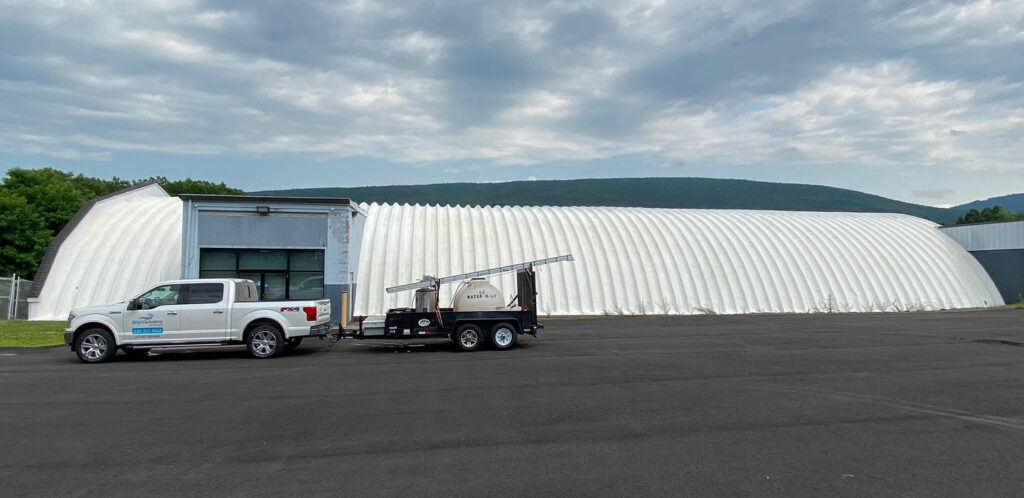 Bright Solutions ProWash truck parked in front of commercial building after professional soft washing and pressure cleaning in Hudson Valley, NY