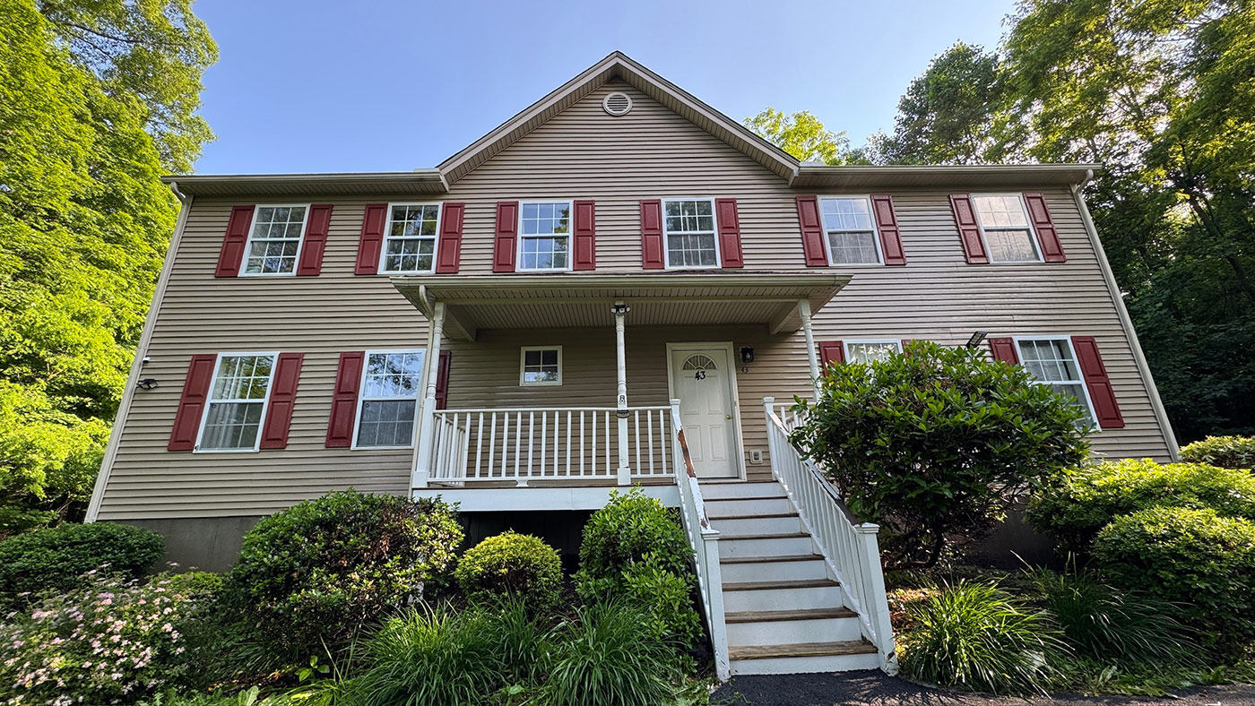 Clean residential house exterior after professional soft washing by Bright Solutions ProWash in Hudson Valley