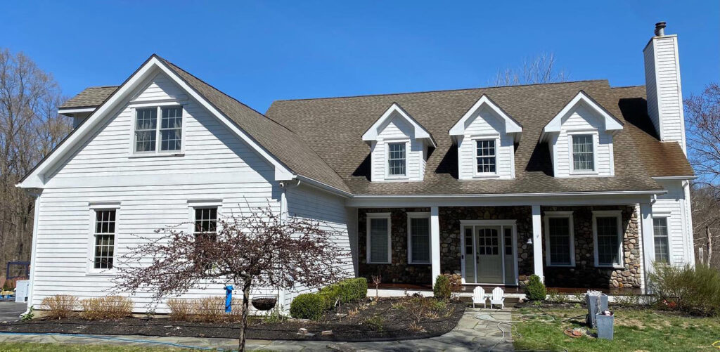 Clean residential house exterior after professional soft washing by Bright Solutions ProWash in Hudson Valley, showing bright and restored siding